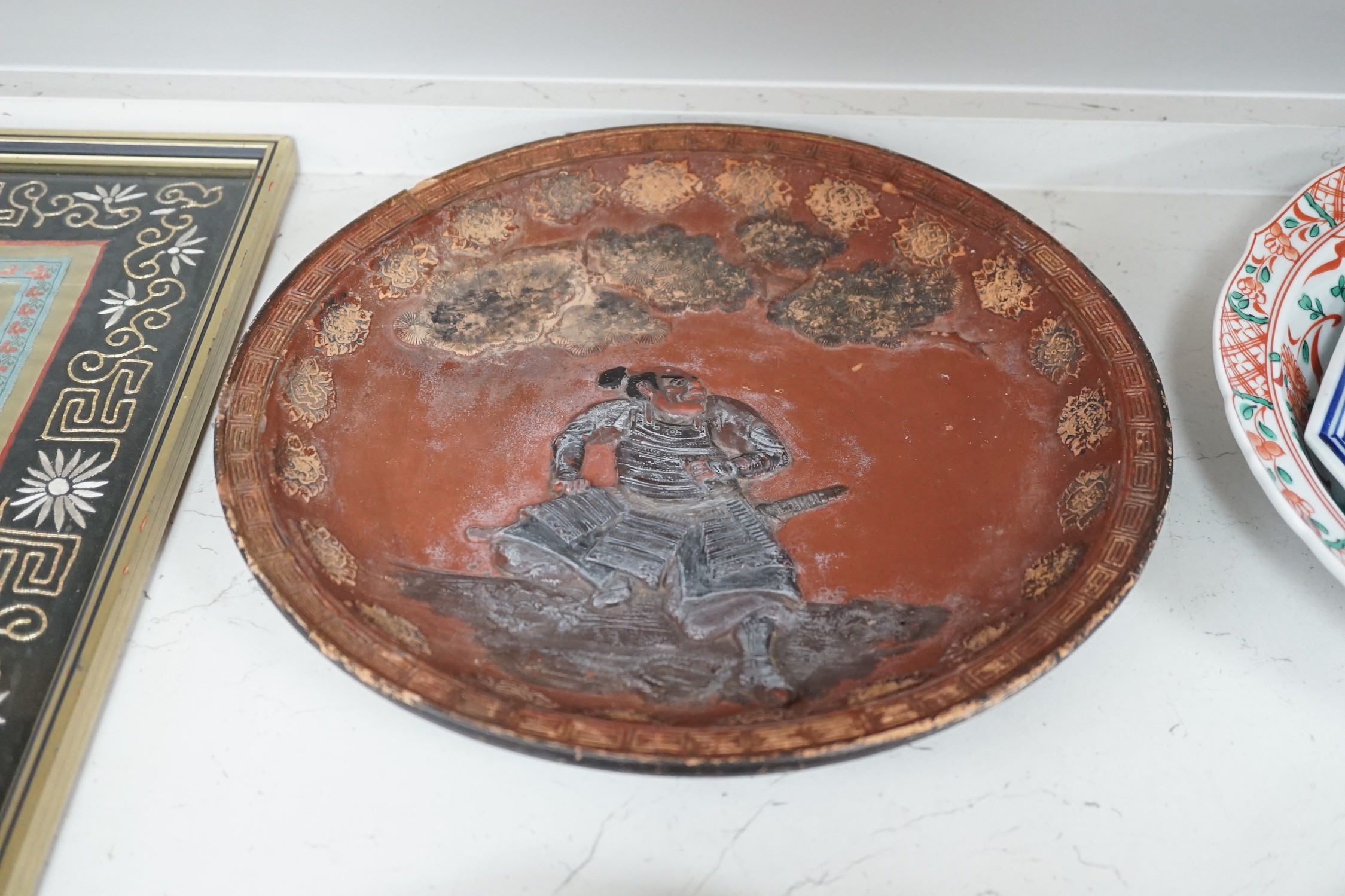 A group of 19th/20th century Japanese porcelain and pottery dishes. Largest 33cm diameter